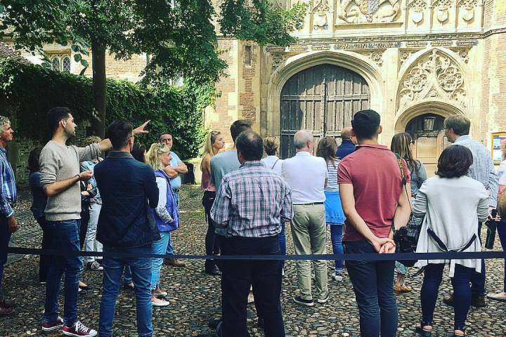 a group of people standing in front of a building