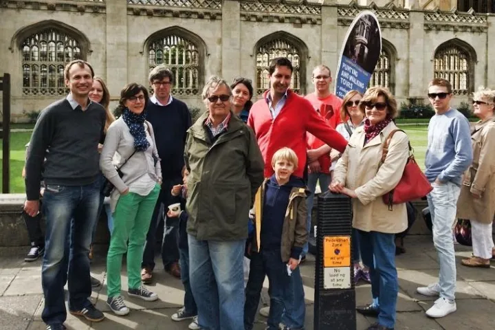 a group of people standing in front of a building