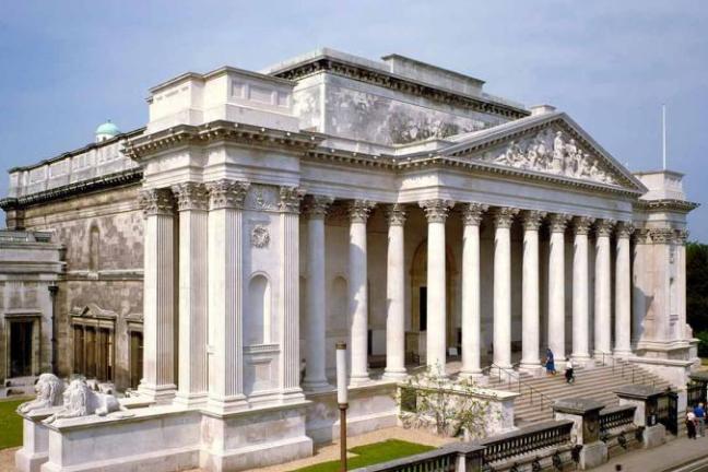 a large white building with Fitzwilliam Museum in the background