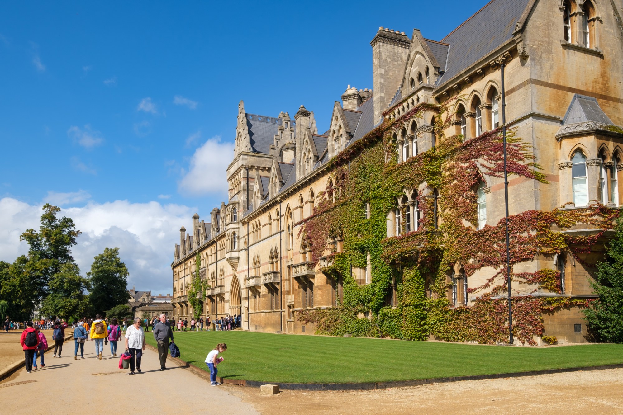Outdoors and open spaces image a group of people standing in front of a castle