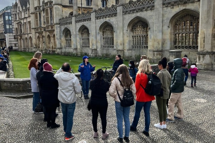 a group of people standing in front of a building