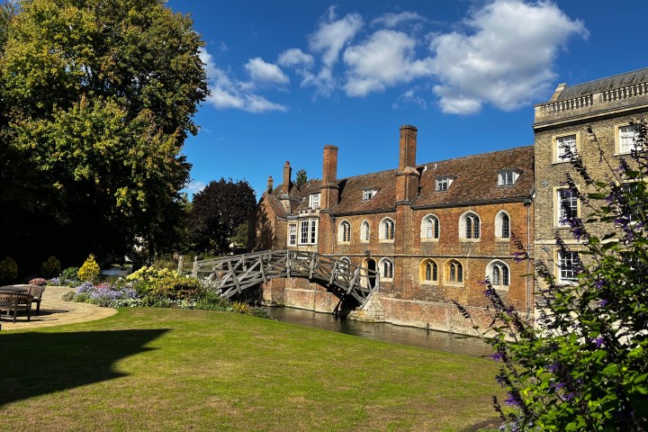 a castle on top of a grass covered field
